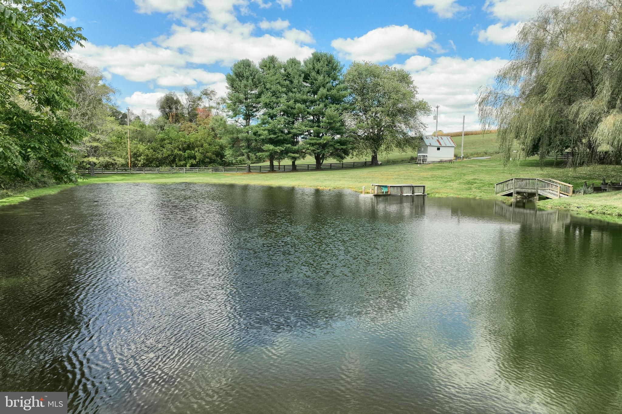 61 West McKinley Road Delta, PA 17314 - Photo 19 of 94 a view of a lake with houses in the back