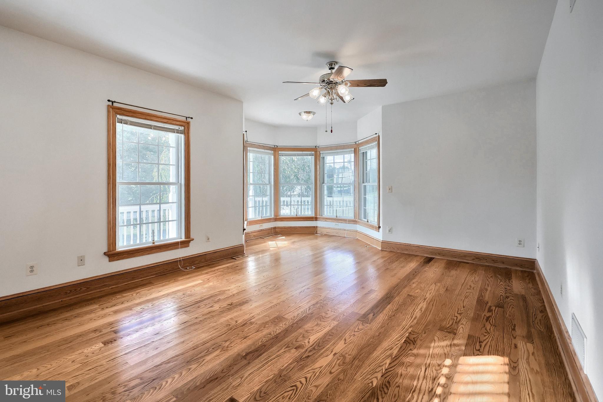 61 West McKinley Road Delta, PA 17314 - Photo 34 of 94 a view of an empty room with wooden floor and a window