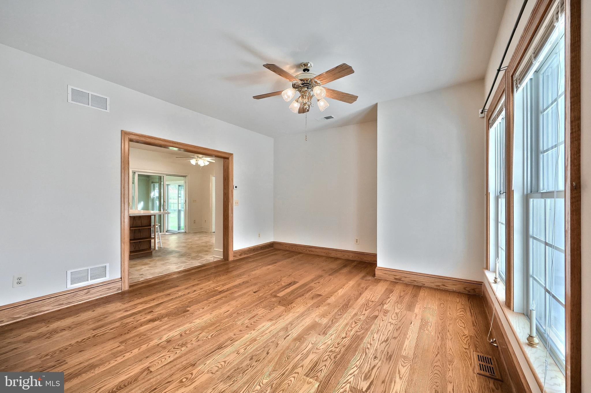 61 West McKinley Road Delta, PA 17314 - Photo 35 of 94 wooden floor in an empty room with a window