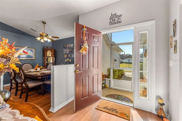 a view of a livingroom with furniture and a chandelier
