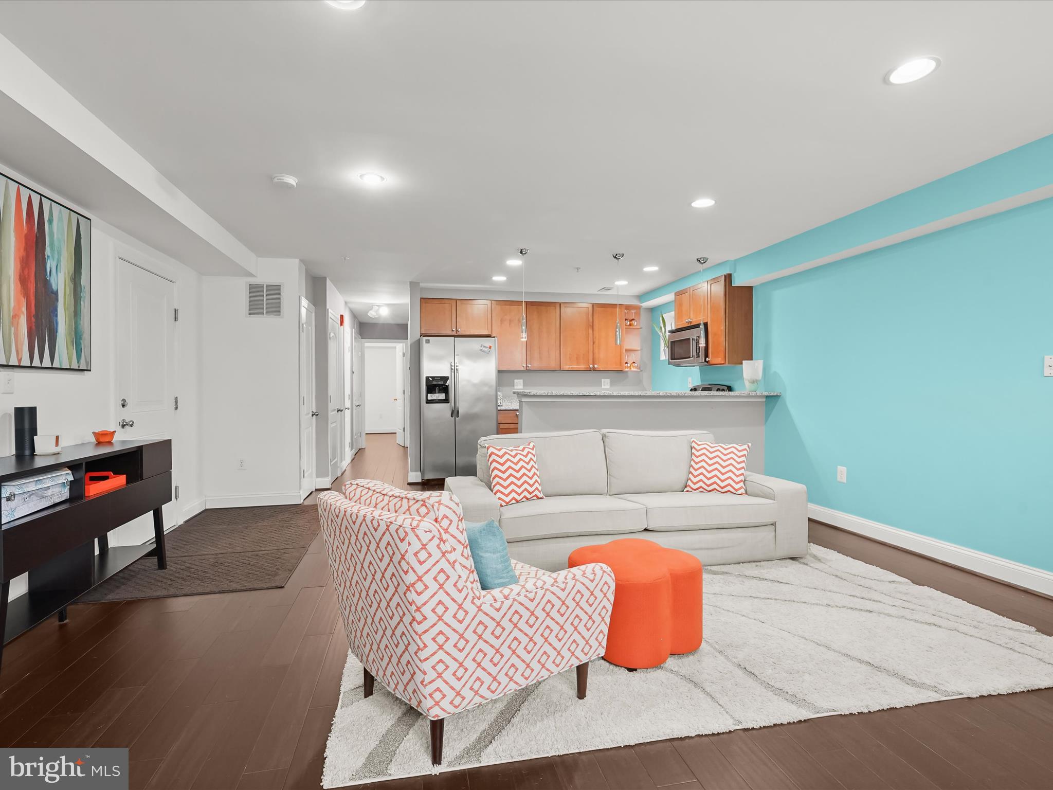 911 Kennedy Street Northwest, Unit 1 Washington, DC 20011 - Photo 2 of 18 a living room with furniture and a flat screen tv