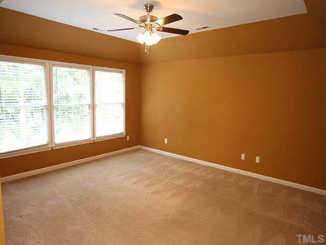 8405 Evans Mill Place Raleigh, NC 27613 - Photo 13 of 25 The second floor master features a vaulted/trey ceiling and new fan. The carpet in the home is a top grade. Master Bedroom