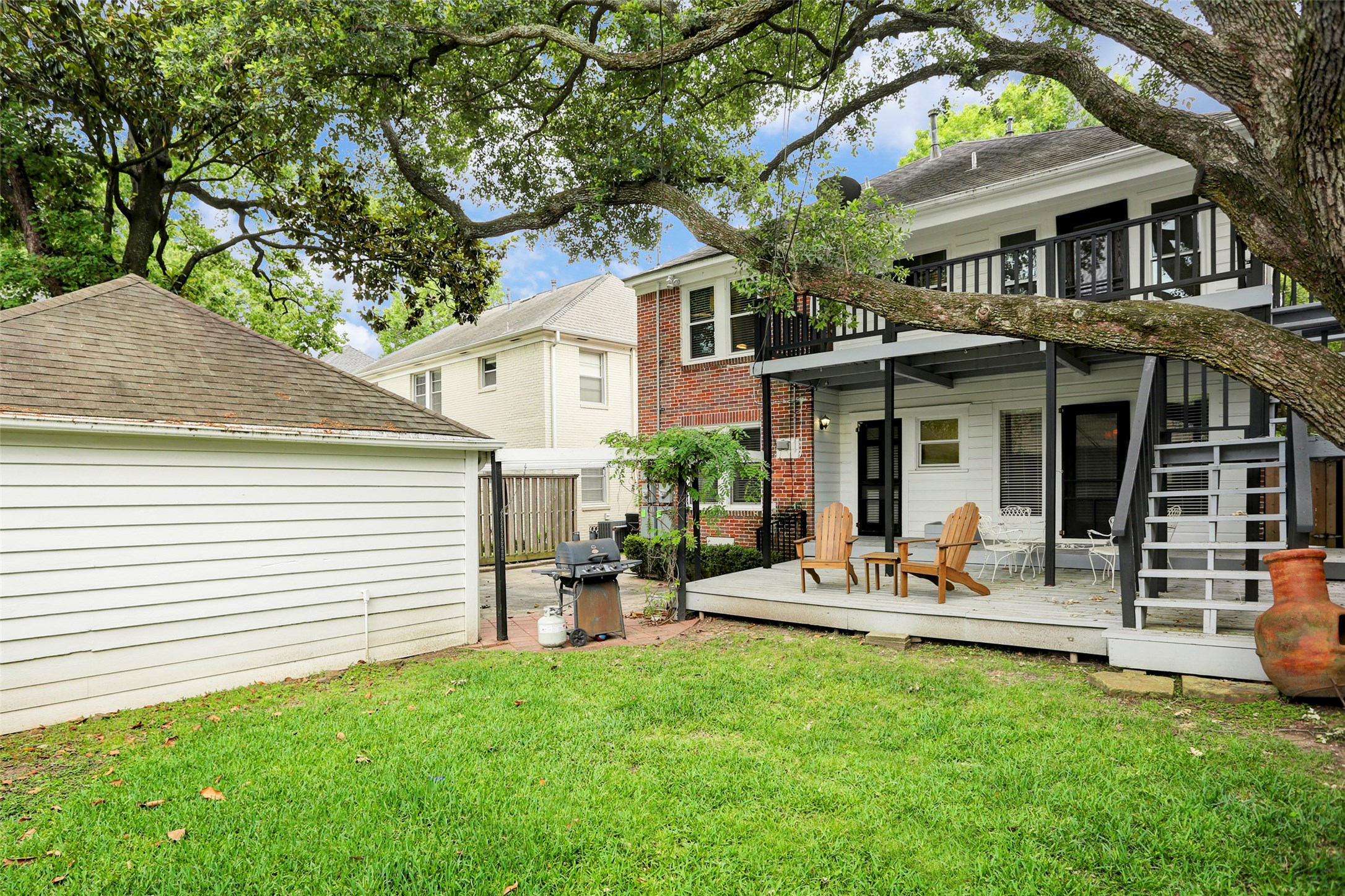 2324 Goldsmith Street, Unit B Houston, TX 77030 - Photo 13 of 19 a view of a house with a yard porch and furniture