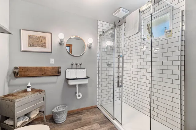 a backyard of a house with barbeque oven table and chairs