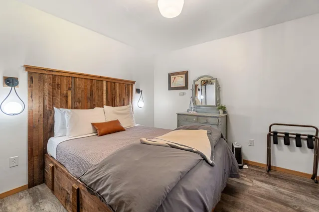 a dining hall with stainless steel appliances granite countertop a stove and a refrigerator