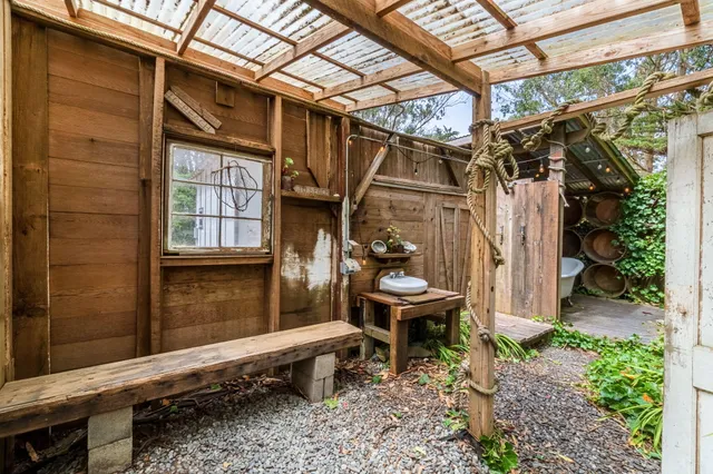 a bathroom with a toilet and a mirror