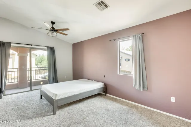 a bedroom with a bed and window
