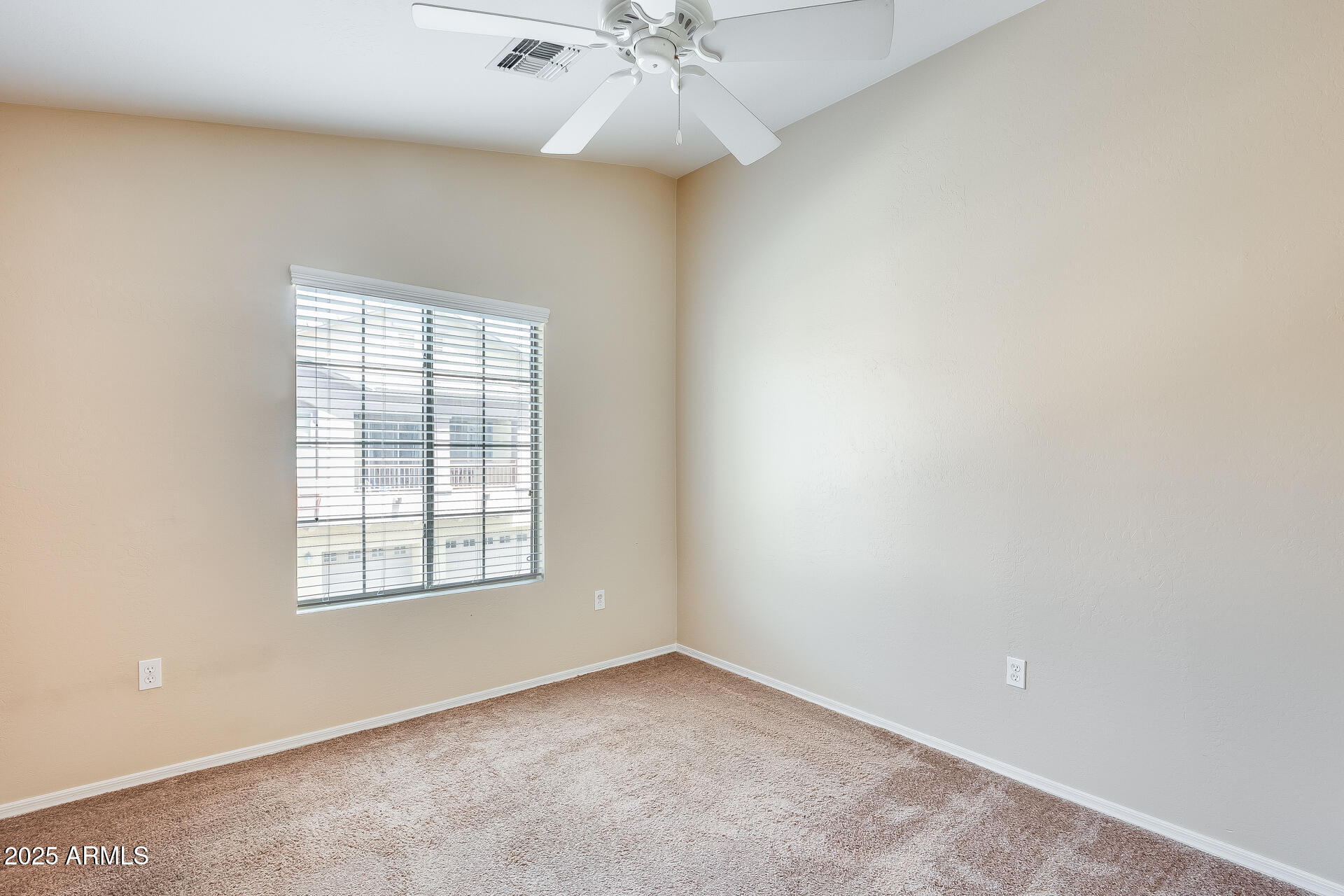 2024 South Baldwin, Unit 113 Mesa, AZ 85209 - Photo 19 of 28 an empty room with a window and a ceiling fan