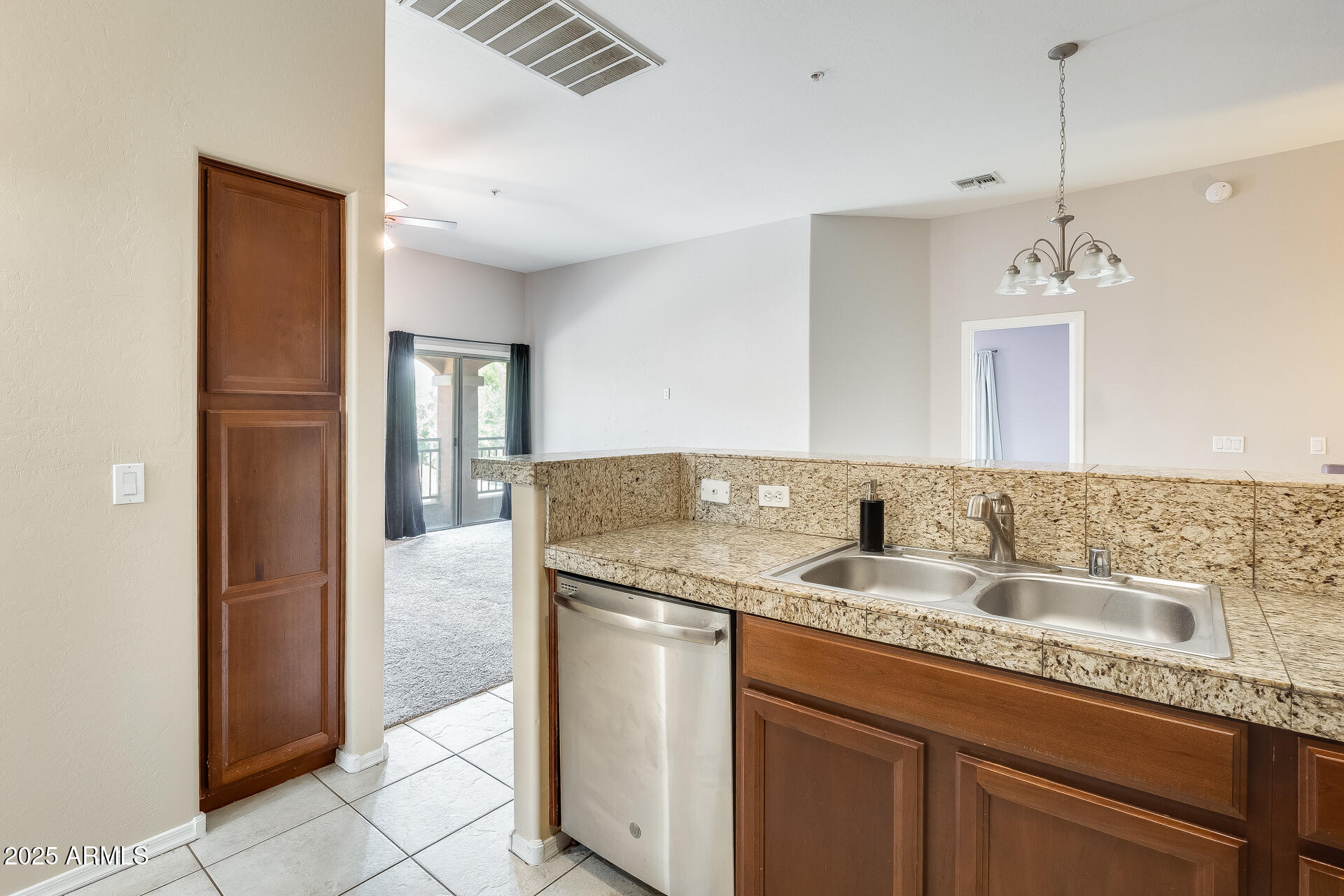 2024 South Baldwin, Unit 113 Mesa, AZ 85209 - Photo 22 of 28 a bathroom with a granite countertop sink and a mirror