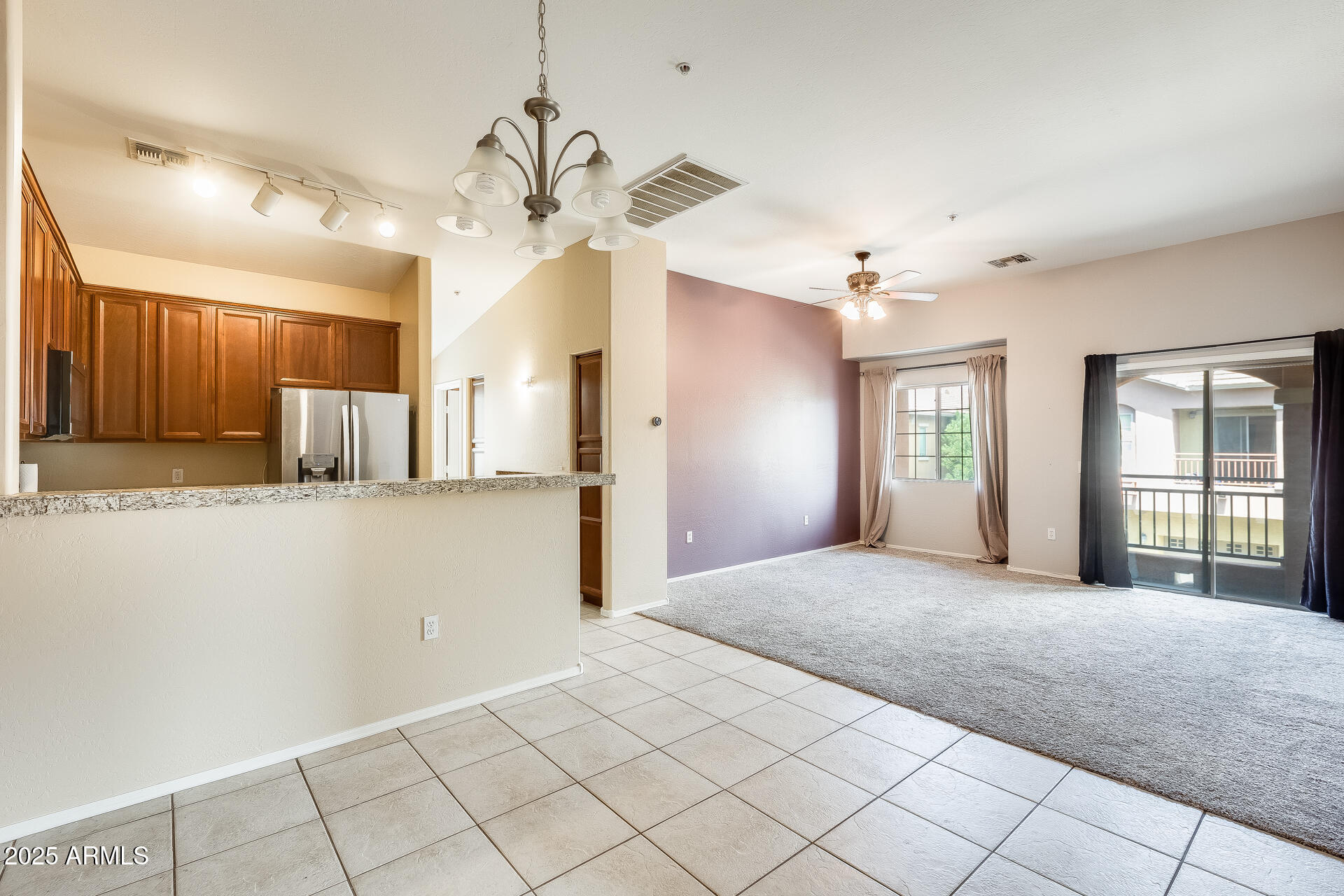 2024 South Baldwin, Unit 113 Mesa, AZ 85209 - Photo 2 of 28 a view of an empty room with a window and a kitchen