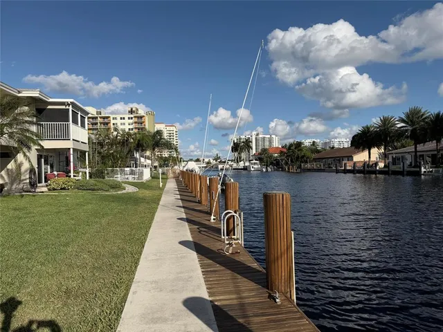 a swimming pool view with a lake view