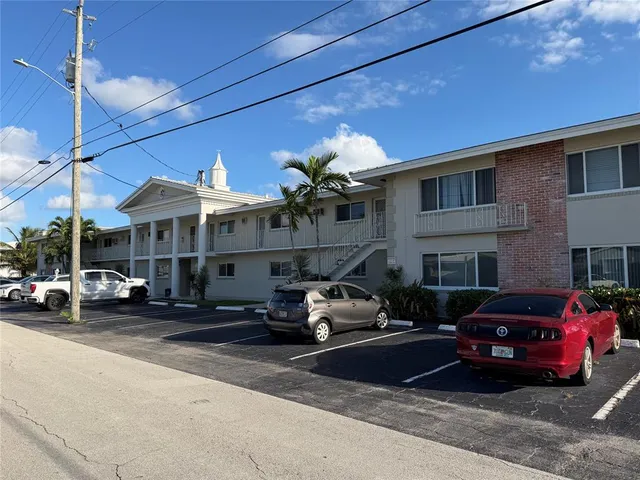 a view of a balcony with furniture