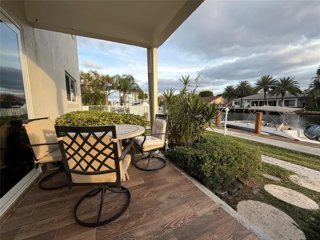 a view of a chairs and table in the patio
