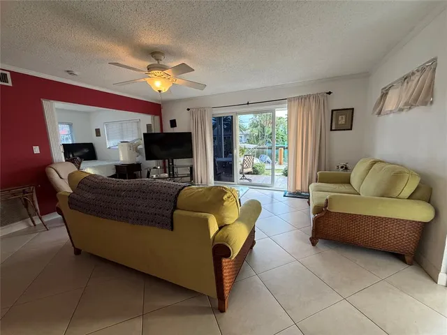 a view of a chairs and table in the balcony