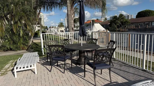 a view of backyard with wheel chair and potted plants