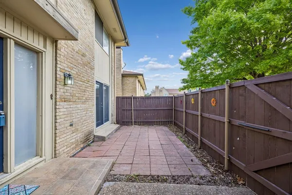 a front view of a house with a yard and a garage