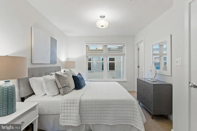 a bedroom with a large bed and furniture