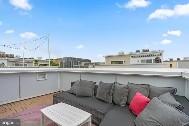 a terrace with a table and chairs