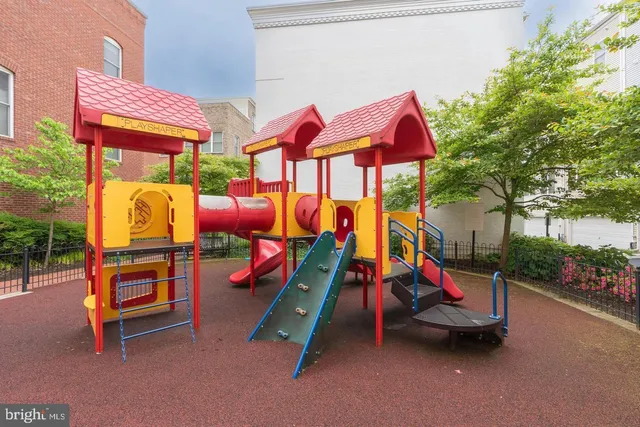 swimming pool with outdoor seating and city view
