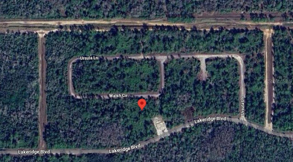 375 Walsh Circle Lehigh Acres, FL 33920 - Photo 2 of 2 a view of street from a balcony