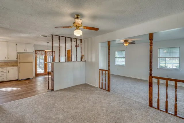 a building outdoor space with patio furniture and potted plants