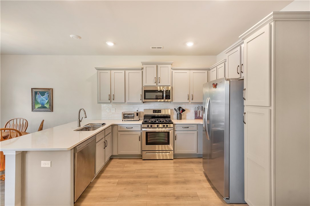 111 Coosa Lane Anderson, SC 29621 - Photo 19 of 36 Streamlined kitchen features plentiful cabinetry, durable countertops, and sleek stainless steel appliances.