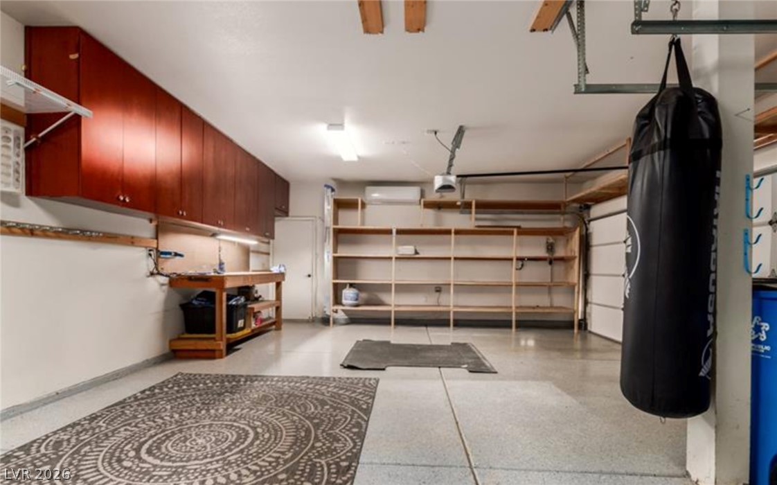 264 Pointe Ranier Avenue Henderson, NV 89012 - Photo 39 of 43 A well-organized garage features abundant cabinetry and shelving for all storage needs.