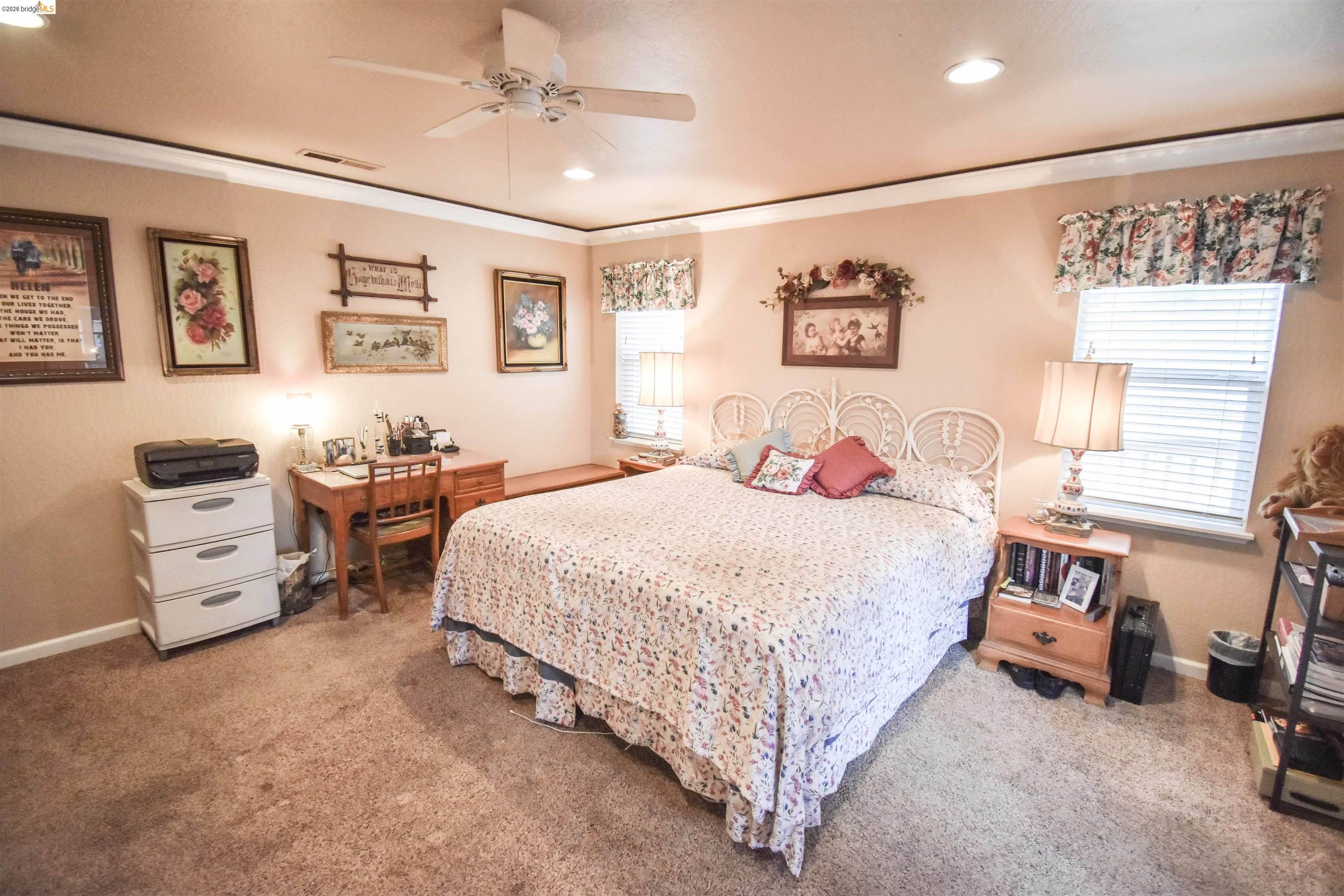 10569 Jim Brady Road Jamestown, CA 95327 - Photo 14 of 21 a bedroom with a bed a couch and a window