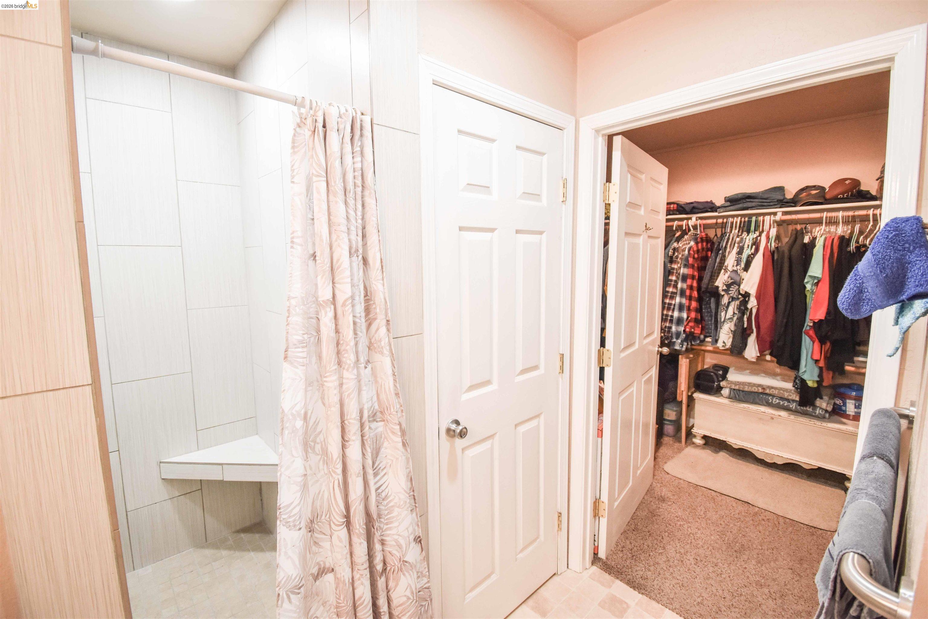 10569 Jim Brady Road Jamestown, CA 95327 - Photo 15 of 21 a view of walk in closet with clothes and shoes