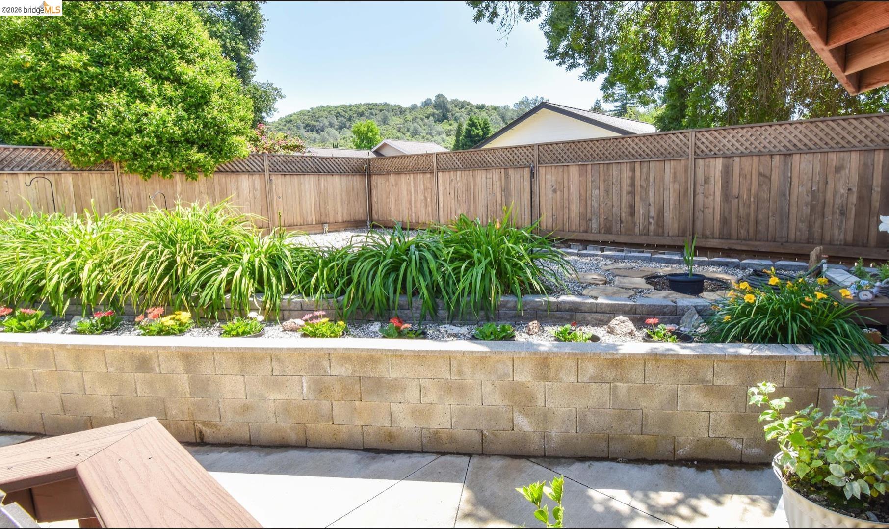 10569 Jim Brady Road Jamestown, CA 95327 - Photo 18 of 21 a small garden with a bench