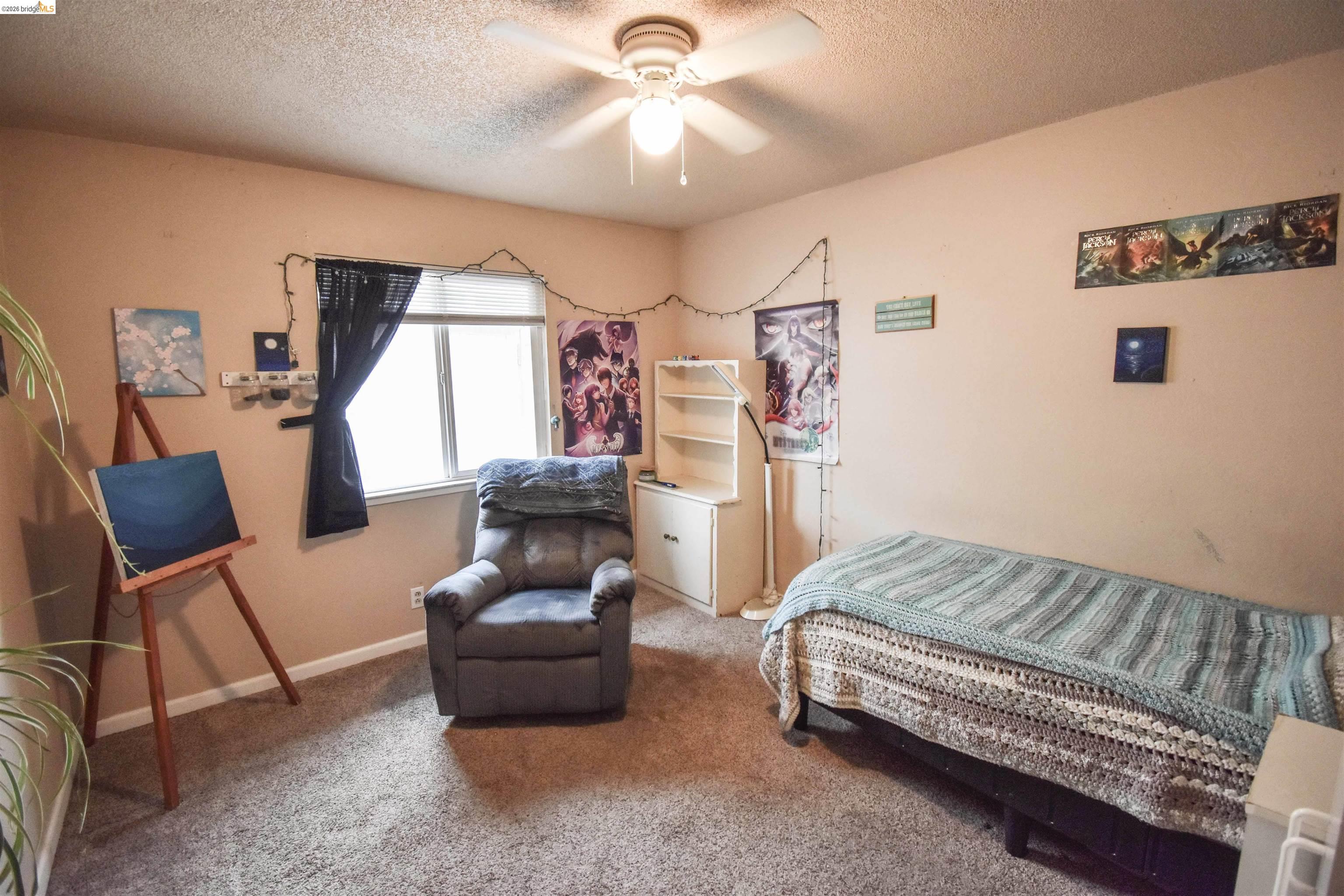 10569 Jim Brady Road Jamestown, CA 95327 - Photo 10 of 21 a bedroom with a bed and furniture