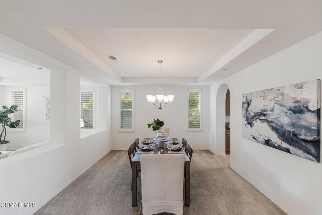 7020 Highgrove Place Moorpark, CA 93021 - Photo 11 of 59 a living room with furniture and a chandelier