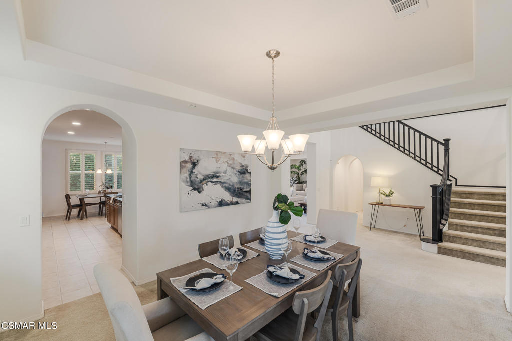 7020 Highgrove Place Moorpark, CA 93021 - Photo 13 of 59 a living room with furniture and a chandelier