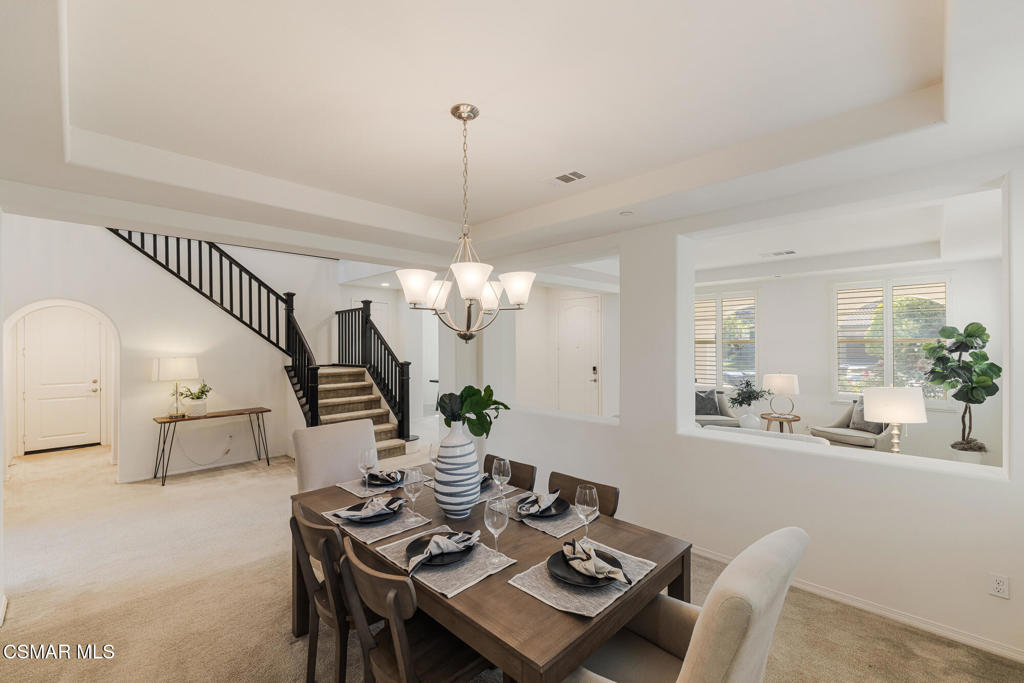 7020 Highgrove Place Moorpark, CA 93021 - Photo 14 of 59 a view of a dining room with furniture and wooden floor