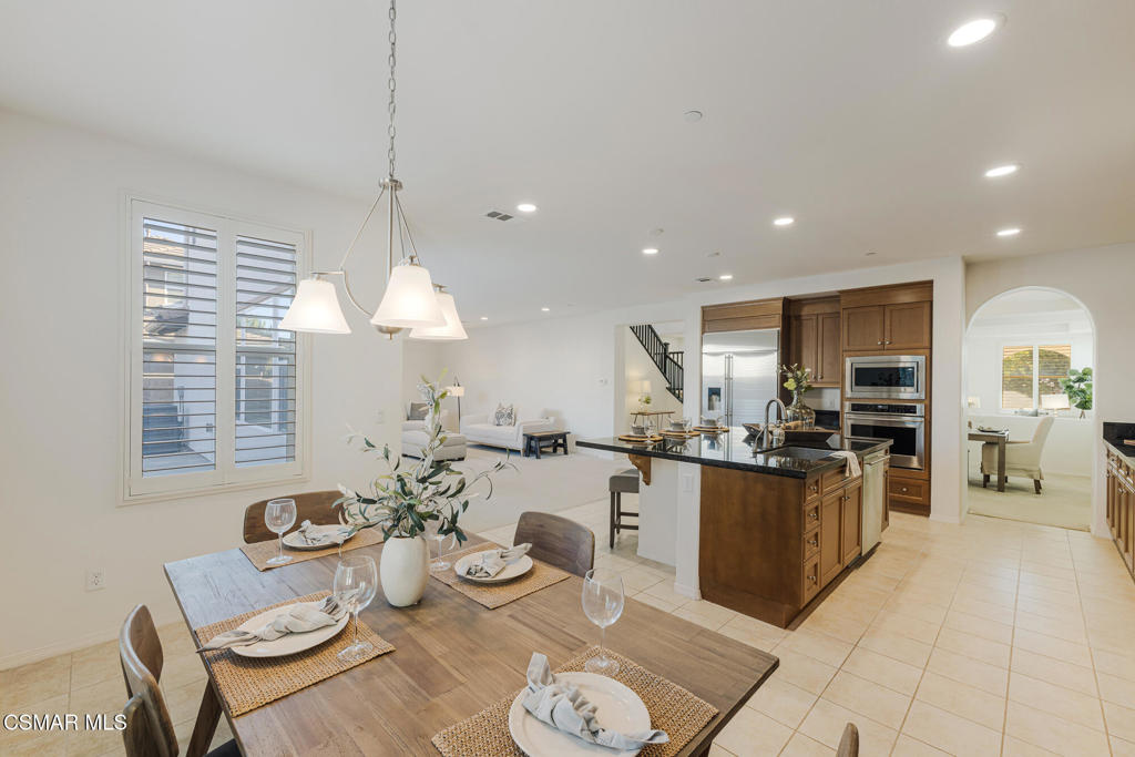 7020 Highgrove Place Moorpark, CA 93021 - Photo 25 of 59 a kitchen with stainless steel appliances kitchen island granite countertop a sink and a refrigerator
