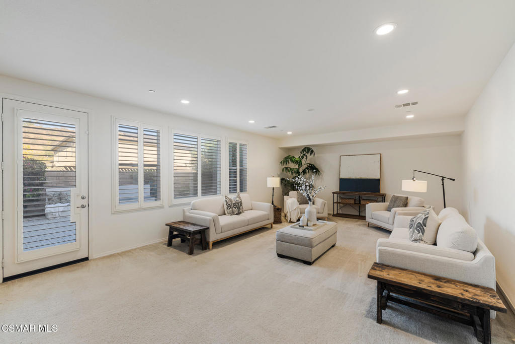 7020 Highgrove Place Moorpark, CA 93021 - Photo 27 of 59 a living room with furniture and a large window