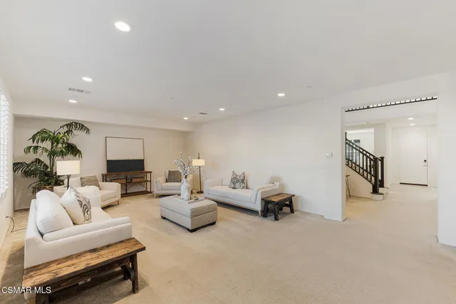 a bathroom with a granite countertop sink a large mirror and a