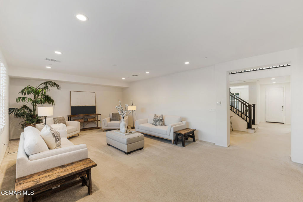 7020 Highgrove Place Moorpark, CA 93021 - Photo 28 of 59 a living room with furniture and a gym machine with the view of living room