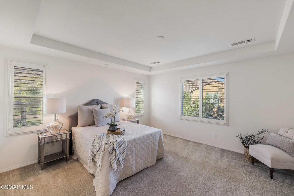 7020 Highgrove Place Moorpark, CA 93021 - Photo 40 of 59 a bedroom with a bed and a couch