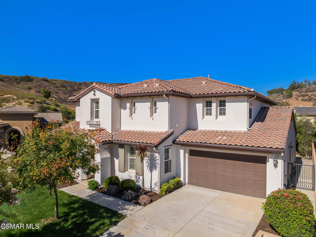 7020 Highgrove Place Moorpark, CA 93021 - Photo 53 of 59 a front view of a house with a yard