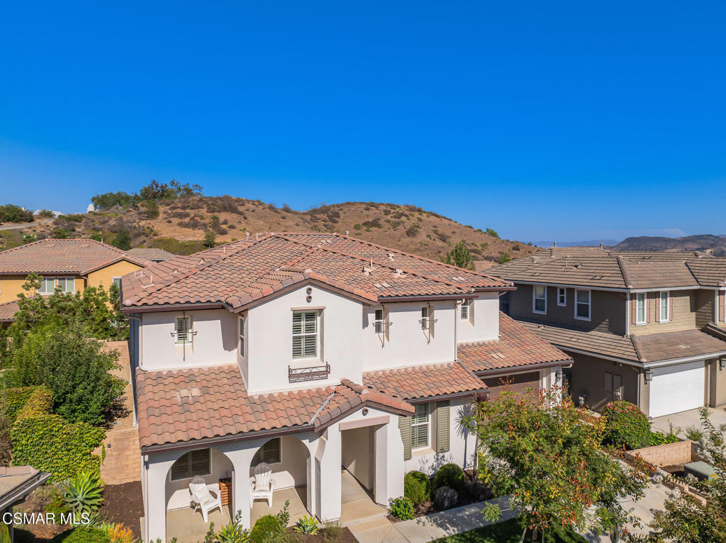 7020 Highgrove Place Moorpark, CA 93021 - Photo 54 of 59 a front view of a house with a yard