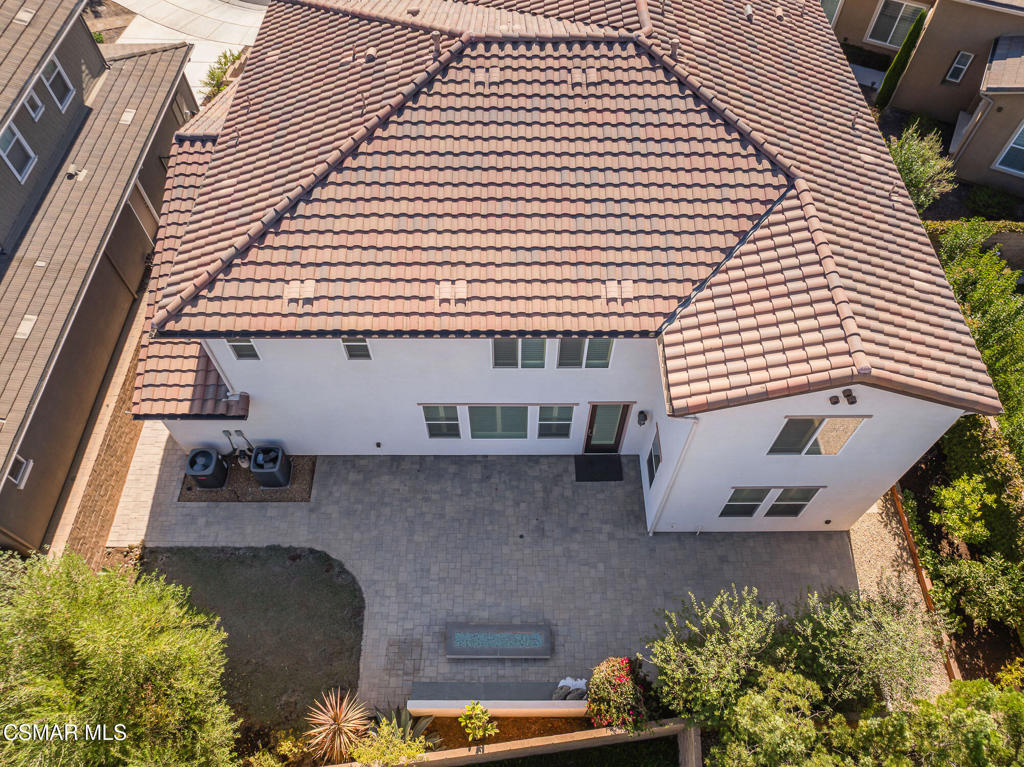 7020 Highgrove Place Moorpark, CA 93021 - Photo 56 of 59 a front view of a house with a garden