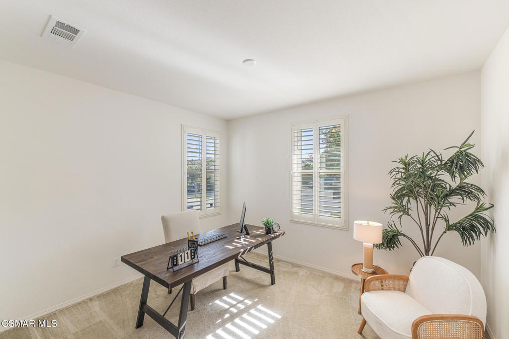 7020 Highgrove Place Moorpark, CA 93021 - Photo 9 of 59 a living room with furniture and a potted plant