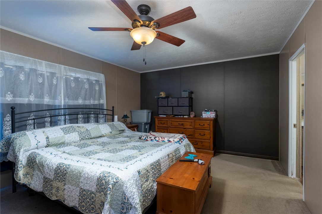 1926 Fairview Road Peebles, OH 45660 - Photo 22 of 44 This inviting bedroom provides a comfortable retreat with ample space and essential amenities.