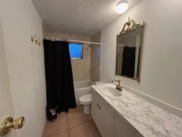 a bathroom with a double vanity sink and mirror