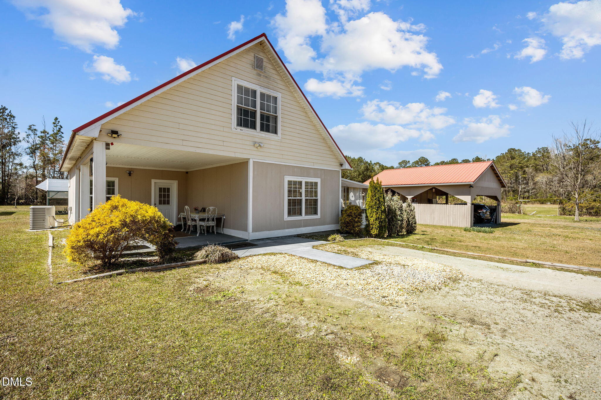 828 Chair Factory Road Nakina, NC 28455 - Photo 8 of 54 a house view with a outdoor space
