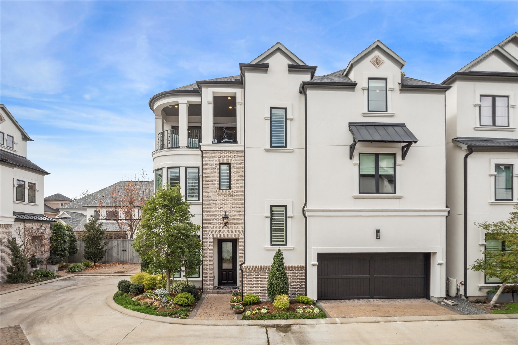 a front view of a residential houses with yard