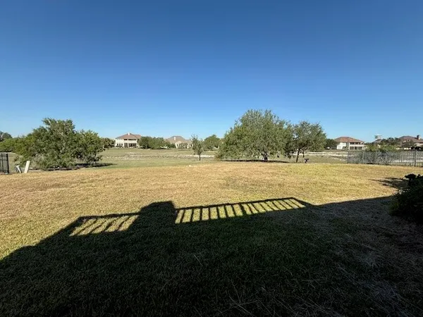 a view of a lake from a yard
