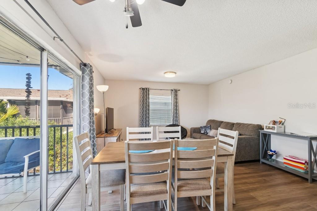 13125 Wilcox Road, Unit 6205 Largo, FL 33774 - Photo 6 of 48 a view of a dining room with furniture window and wooden floor