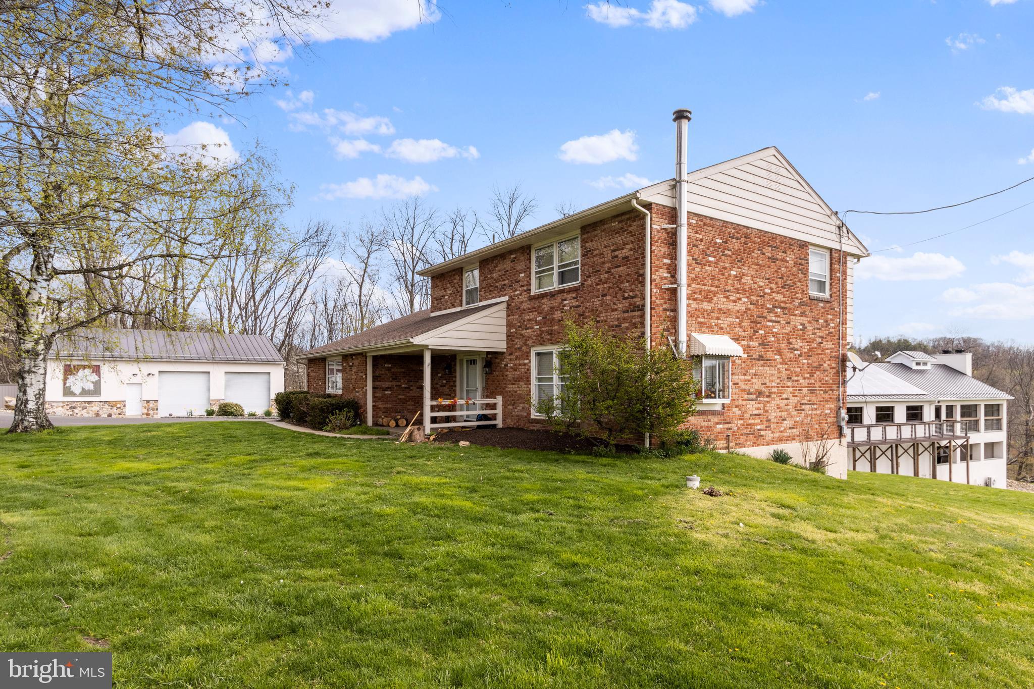 91 Nuss Road Bechtelsville, PA 19505 - Photo 5 of 7 a view of a house with a yard and sitting area